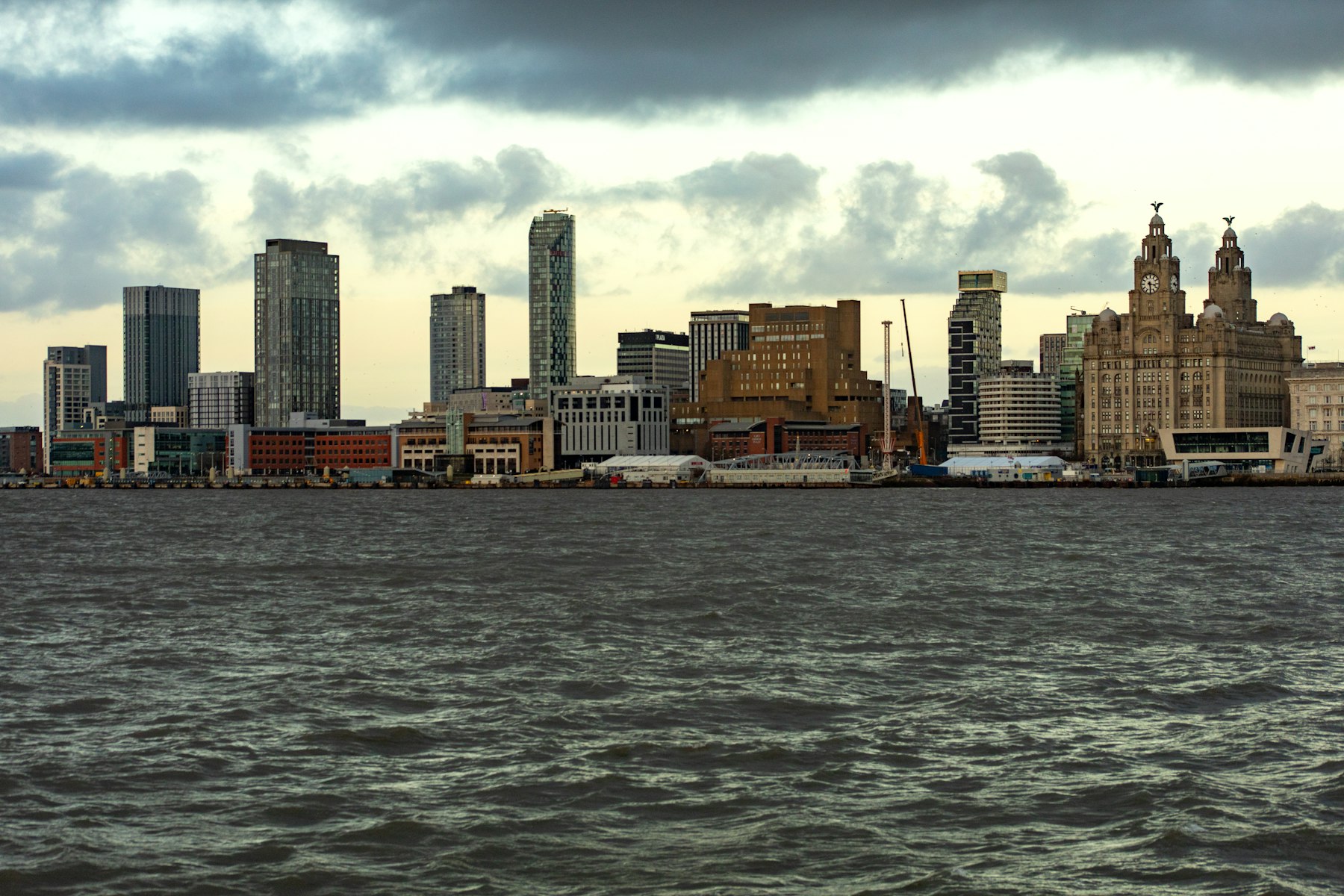 The Liverpool waterfront seen across the River Mersey, with the Royal Liver Building and city skyline